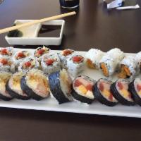 Rock and Roll · Shrimp tempura, cream cheese, crab stick, cucumber, crunch, and eel sauce.
