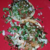 Tacos · Served with onions, cilantro and salsa.