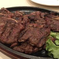 Korean BBQ · Korean style BBQ short rib marinated, grilled and served with a side of rice. Served with mi...