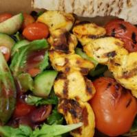 Chicken Kabob · Saffron marinated chicken breast grilled on open flame. Served with grilled vegetables and y...