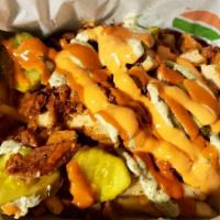 Loaded Shovel · A heaping serving of seasoned spuds, topped with grilled, seasoned Beyond Beef, chick'n tend...