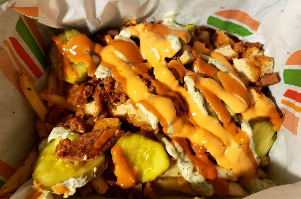 Loaded Shovel · A heaping serving of seasoned spuds, topped with grilled, seasoned Beyond Beef, chick'n tenders, melty plant-based cheese sauce and all 3 homemade Patch sauces - House, Ranch and BBQ. Contains cashews, soy & gluten.