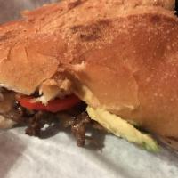 Cheesesteak Torta · Steak, grilled pepper and onions, avocado, and cheese.