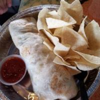 Rumba Burrito · A fresh cooked flour tortilla filled with your choice of meat, beans, rice, corn, cheese, sa...