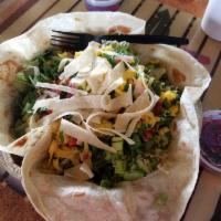 Rumba Salad · Fresh cooked flour tortilla bowl filled with your choice of meat, beans, rice, corn, leafy g...