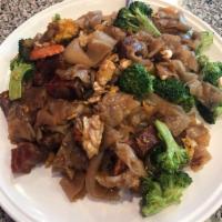 Pad See Ew · Rice noodles, stir-fried meat, egg, broccoli and carrot.