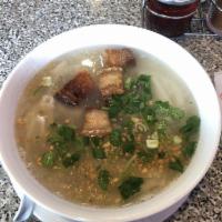 Khao Piak · Shredded chicken, crispy pork, homemade noodles, fried garlic, green onion and cilantro.