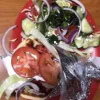 Chicken Gyro · Thin marinated slices of chicken topped with fresh lettuce, onions, tomatoes, and tzatziki s...