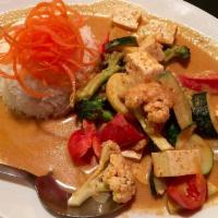 Panang Curry · Red curry paste and coconut milk with bell pepper and fresh basil.