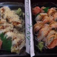 Pink Lady Roll · Shrimp tempura and crabstick inside. Topped with crabmeat mix and crunchy flakes with eel sa...