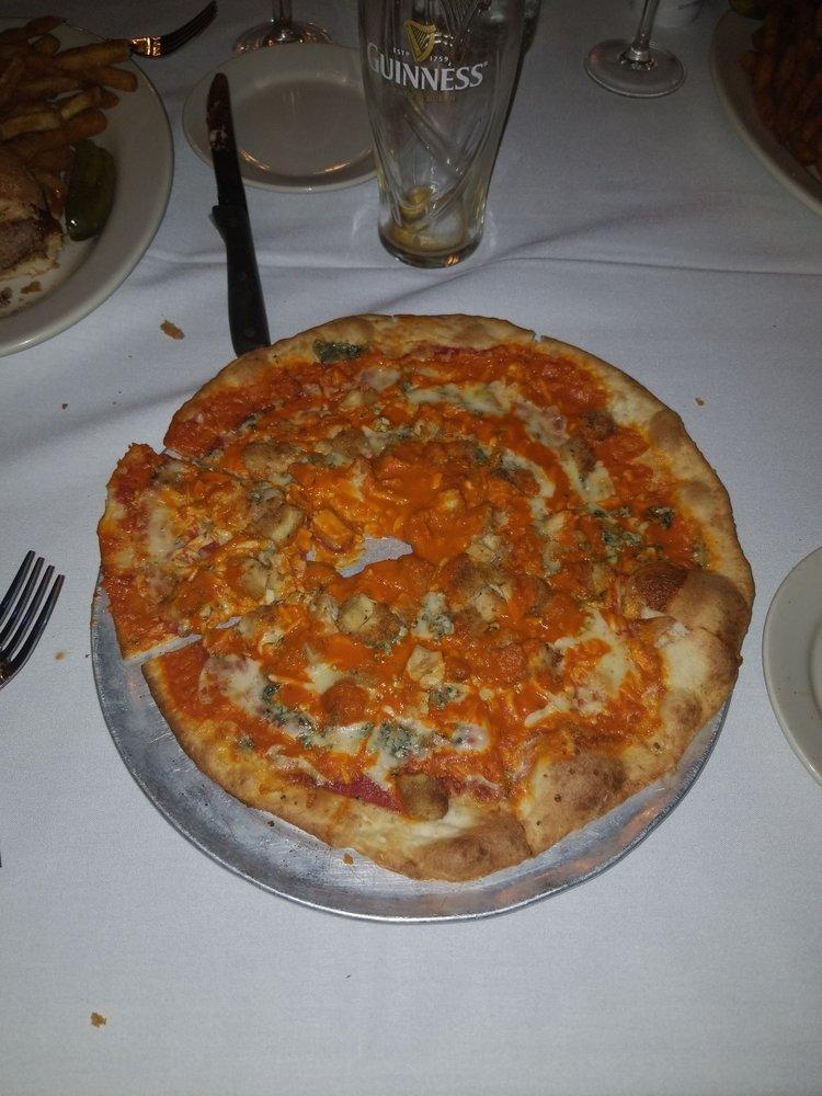 Buffalo Chicken Pizza · Mozzarella, crumbled blue cheese, light pizza sauce, fried chicken, Buffalo sauce, scallions.