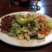 Cobb Salad · Gluten friendly. Romaine, diced grilled chicken, bacon, crumbled blue cheese, avocado, tomat...