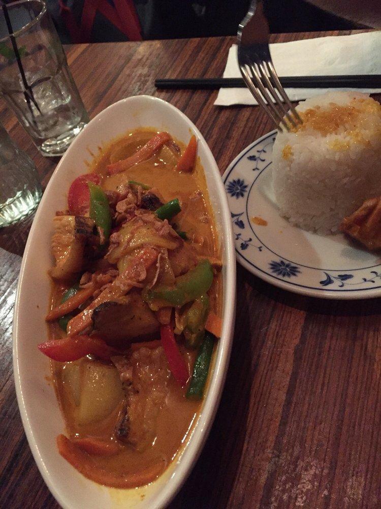 Red Curry · Thai spices blended in chili paste with bamboo shoots, basil, and bell peppers simmered in coconut milk. Spicy.