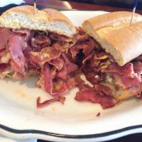 Pastrami Sandwich · Prepared with pastrami, mustard and pickle chips on a French roll.