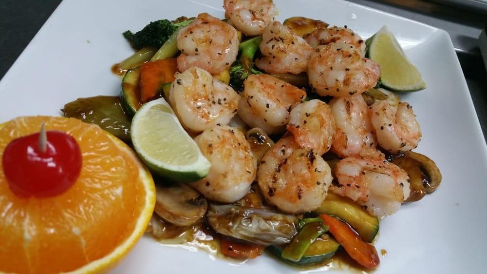 Grilled Lime Pepper Shrimp · Smoke flavored jumbo shrimp from the grill, topped with butter and lime pepper seasoning. Served with rice.