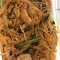 Pad Thai · Stir fried Thai noodle with egg, tofu, and bean sprout, topped with peanuts and lime on the ...