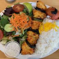 Chicken Kabob · Grilled pieces of chicken breast marinated in lemon juice and saffron with bell peppers and ...