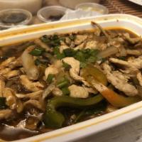 Thai Basil Ginger Chicken · Sliced chicken cooked with ginger, black mushroom, onions, and basil.