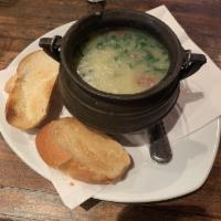 Caldo Verde · Brazilian style potato soup with smoked Brazilian sausage and collard green.