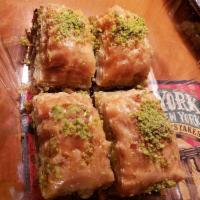 Baklava · Sweet pastry made of extremely thin sheets of phyllo dough, layered with chopped nuts and ho...