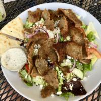 Greek Salad · Mixed greens tossed with Greek dressing, tomatoes, cucumbers, feta, Kalamata olives, onions ...