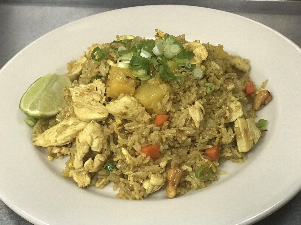 Pineapple Fried Rice · Egg, pineapple, onion, garlic, curry powder, carrot, pea, cashew nut and scallion.