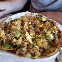 Mayan Skillet · Chorizo sausage, jalapeno, avocado, onions, and cheddar. Served with 2 eggs any style, hash ...