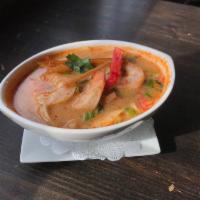Tom Yum Soup · Spiced and sour soup with shrimp, mushrooms, lemongrass, chili and kaffir lime leaves.