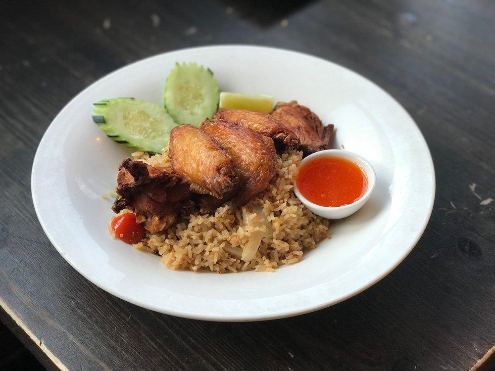 Bangkok Fried Rice · Thai style chicken wings with basil fried rice.