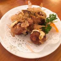 Takoyaki · Ball-shaped octopus dumpling.