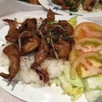 Caramelized Quail · Crispy quail caramelized in a garlic pepper marinade with steamed rice and salad.
