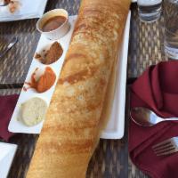 Masala Dosa · White lentil and rice crepe topped with potato filling served sambar and chutney.