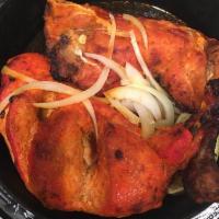 Chicken Tandoori · Half chicken marinated in a mixture of yogurt, garlic, ginger and other select spices and gr...
