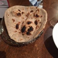 Roti · Unleavened whole wheat bread baked in clay oven.