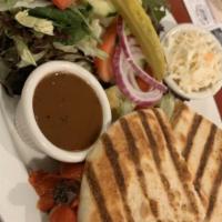 Grilled Chicken Portobello Panini · Served with portobello mushrooms, roasted peppers and mozzarella cheese. Served with balsami...