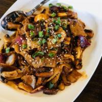 Spicy Korean Pork Belly · Thinly sliced pork belly, onion, mushroom and shiitake mushroom in a spicy Korean BBQ sauce