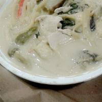 Green Curry · Mix of eggplant, bell pepper, basil and bamboo shoots in a green curry paste and coconut mil...