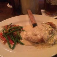 Chicken Fried Chicken · We wouldn’t be a ‘Roadhouse’ without it. Hand-battered, fried golden resting on a bed of gar...
