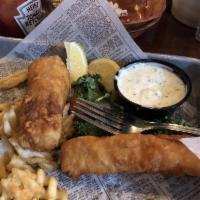 Fish and Chips · Battered Alaskan cod fried golden and served with fries, slaw and a side of tartar.