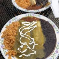 Enchilada · In our housemade corn tortillas served with rice and black beans. Chicken breast and grilled...