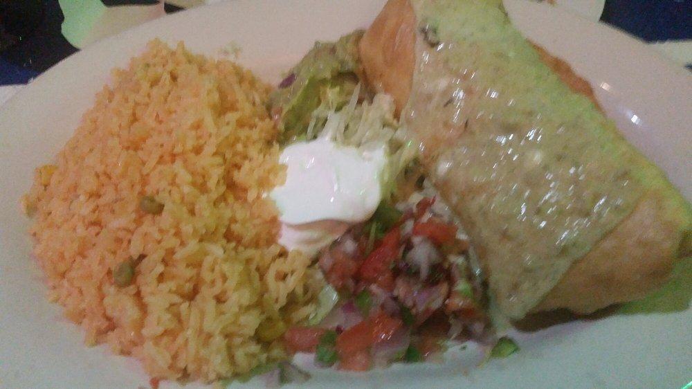 Chimichanga · Deep fried burrito filled with your choice of meat, rice, black beans, and shredded cheese. Topped of with our homemade chimi sauce. Served with pico de gallo and sour cream..