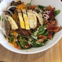 Cobb Salad · Mixed greens, bleu cheese, sharp cheddar cheese, fried egg, applewood smoked bacon, tomatoes...