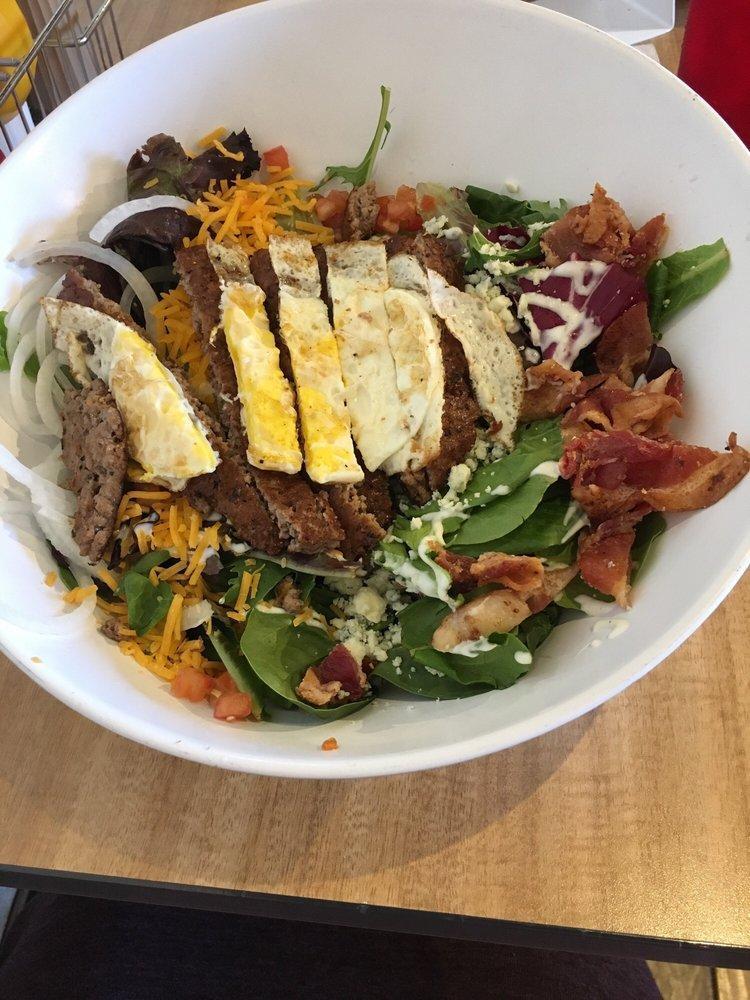 Cobb Salad · Mixed greens, bleu cheese, sharp cheddar cheese, fried egg, applewood smoked bacon, tomatoes, red onions, ranch.