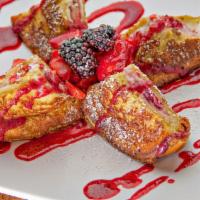 Stuffed French Toast · Classic French Toast stuffed with cream cheese, strawberries, blueberries and topped with a ...