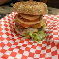 Badmash Burger · Lettuce, badmash sauce, double patty, egg, bacon, Swiss, cheddar cheese, mayo, pickles, onio...
