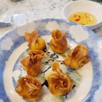 Crab Rangoon · 6 piece. Crab meat smeared with cream cheese, in a wonton wrap.
