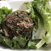 Beef Laap · Chopped grilled beef mixed with sliced purple onion, green onion, cilantro, mint, Thai chili...