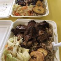Brown Stew Chicken · Served with white rice or rice and peas, steam vegetables or salad.