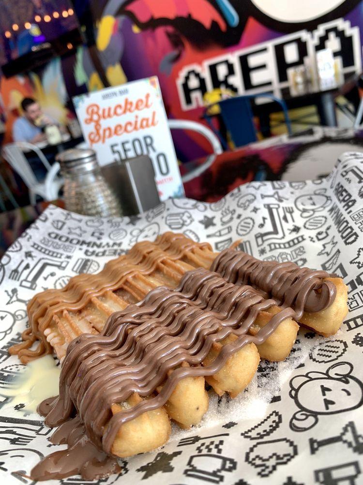 Churros · Topped with nutella, dulce de leche and condensed milk.