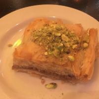 Baklava · Crispy filo dough layered with walnuts and soaked with simple syrup.